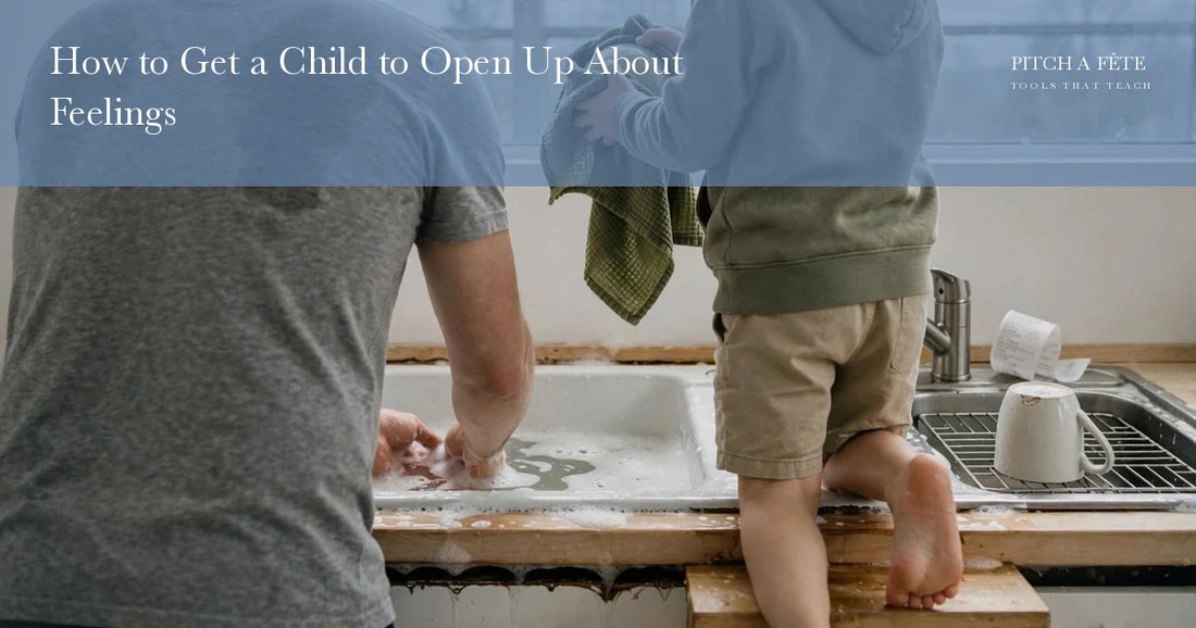 A father and son washing up side by side at a kitchen sink, a lesson in how to get a child to open up about feelings